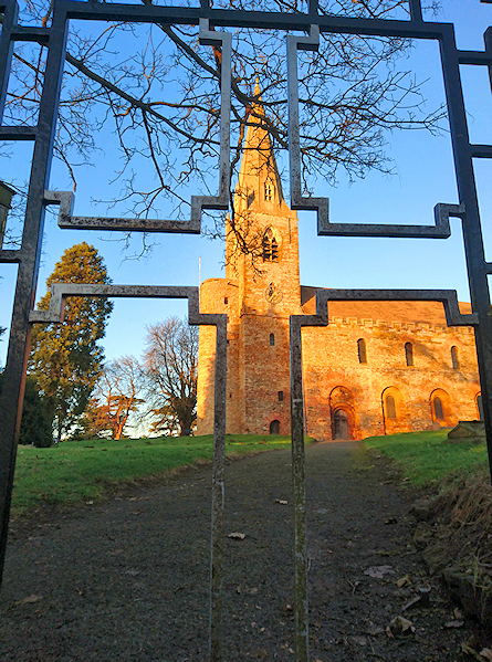 Brixworth church, framed by the metal gate