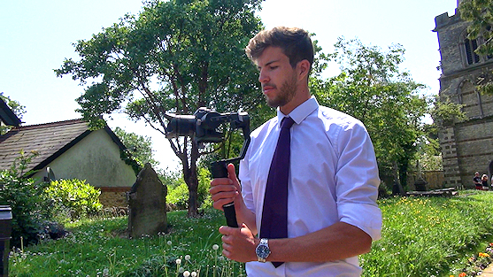 Lundscapes cameraman filming in a churchyard
