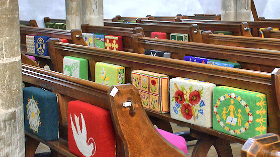 kneeling cushions pictured in church pews
